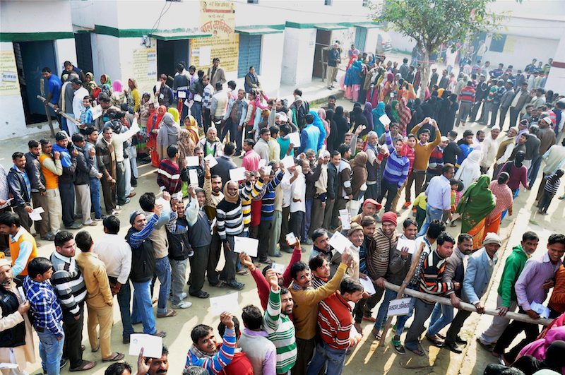Voters stand in queue to cast their vote during the second phase of UP assembly polls 2017 in Moradabad. Source PTI